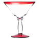 A Libbey martini glass with a clear bowl and red rim.