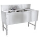 An Advance Tabco stainless steel underbar sink with 3 compartments, a drainboard, and a splash mount faucet.