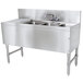 An Advance Tabco stainless steel underbar sink with 3 compartments, a drainboard, and a faucet.