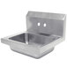A stainless steel Advance Tabco hand sink with two holes in the bottom.