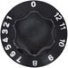A black circular knob with white numbers.