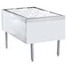 A stainless steel rectangular ice bin with ice in it.