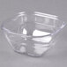 A clear square Dinex plastic bowl with a lid.