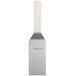 A white rectangular spatula with a white plastic handle.