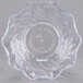 A clear plastic swirl bowl with a circular design.