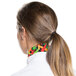 A woman wearing an Intedge multi pepper patterned chef neckerchief on her head.