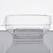 A clear plastic Fineline Wavetrends dome lid on a clear plastic container.