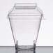 A clear plastic Fineline container with a lid on top.
