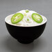 A Karma two-tone melamine bowl filled with noodles and jalapenos.