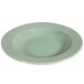 A green Elite Global Solutions Cottage vintage melamine bowl with a round rim and white interior.