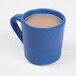 An Elite Global Solutions Base Camp blue speckled melamine mug filled with brown liquid.