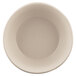 An Elite Global Solutions Papyrus-colored melamine bowl.