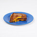 A grilled cheese sandwich on a blue Elite Global Solutions melamine plate.
