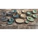 A group of Elite Global Solutions Mojave Vintage California Vanilla crackle bowls on a wood surface.