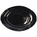 A black oval serving dish with a spiral pattern.