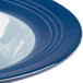 A close-up of a blue and white Elite Global Solutions Durango melamine bowl.