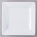 A white square Elite Global Solutions melamine plate with a pebble rim on a gray surface.