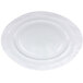 A white oval serving dish with a spiral pattern on the bottom.