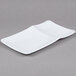 A white rectangular melamine platter with curved edges.
