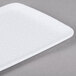 A white rectangular melamine platter with a white background.