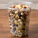 A 32 oz. Square Recycled PET deli container filled with nuts and seeds.