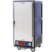 A blue Metro C5 heated holding and proofing cabinet with wheels.