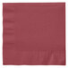 A Creative Converting burgundy paper napkin with a folded edge.