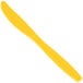 A yellow Creative Converting plastic knife.