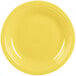 A close-up of a yellow Fiesta dinner plate with a ring on it.