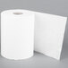A roll of white Merfin Aircell paper towel on a gray surface.
