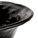 A close-up of a black GET New Yorker serving bowl with a black rim.