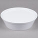 A white round melamine container with a white lid.