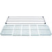 A row of MetroMax Q white metal shelves with white plastic grids.
