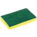 A green 3M Scotch-Brite medium-duty scrub sponge with a yellow sponge on top.