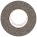 A roll of grey 3M Safety-Walk tape with a white circle.