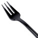 A black plastic WNA Comet tasting fork.
