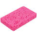 A pink 3M Scotch-Brite sponge with holes.
