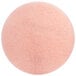 A close-up of a pink circular 3M floor pad.