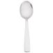 An Arcoroc stainless steel dinner spoon with a white handle.