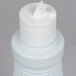 A white plastic bottle of 3M Liquid Stainless Steel Cleaner with a white cap.