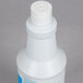 A white plastic bottle of 3M Liquid Stainless Steel Cleaner and Polish with a white cap.