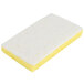 A white and yellow 3M Scotch-Brite light-duty scrub sponge.