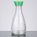 A close-up of a clear glass Town soy sauce bottle with a green top.