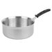 A Vollrath stainless steel saucepan with a black and silver handle.