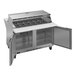 A stainless steel Beverage-Air refrigerated sandwich prep table with open doors.