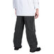 A person wearing Chef Revival black and white pinstripe chef pants.