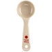 A Carlisle cream colored polycarbonate portion spoon with red lettering.