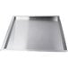 A stainless steel Cooking Performance Group grease tray with a handle.