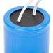 A blue cylindrical Avantco motor start capacitor with white wires attached.