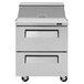 A stainless steel Turbo Air refrigerated sandwich prep table with two drawers.